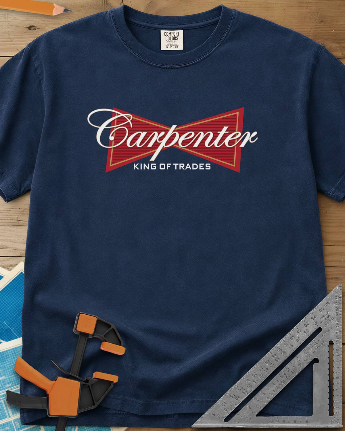 King of Trades heavyweight tee in Navy, a red bow-tie badge with white script and gold trim
