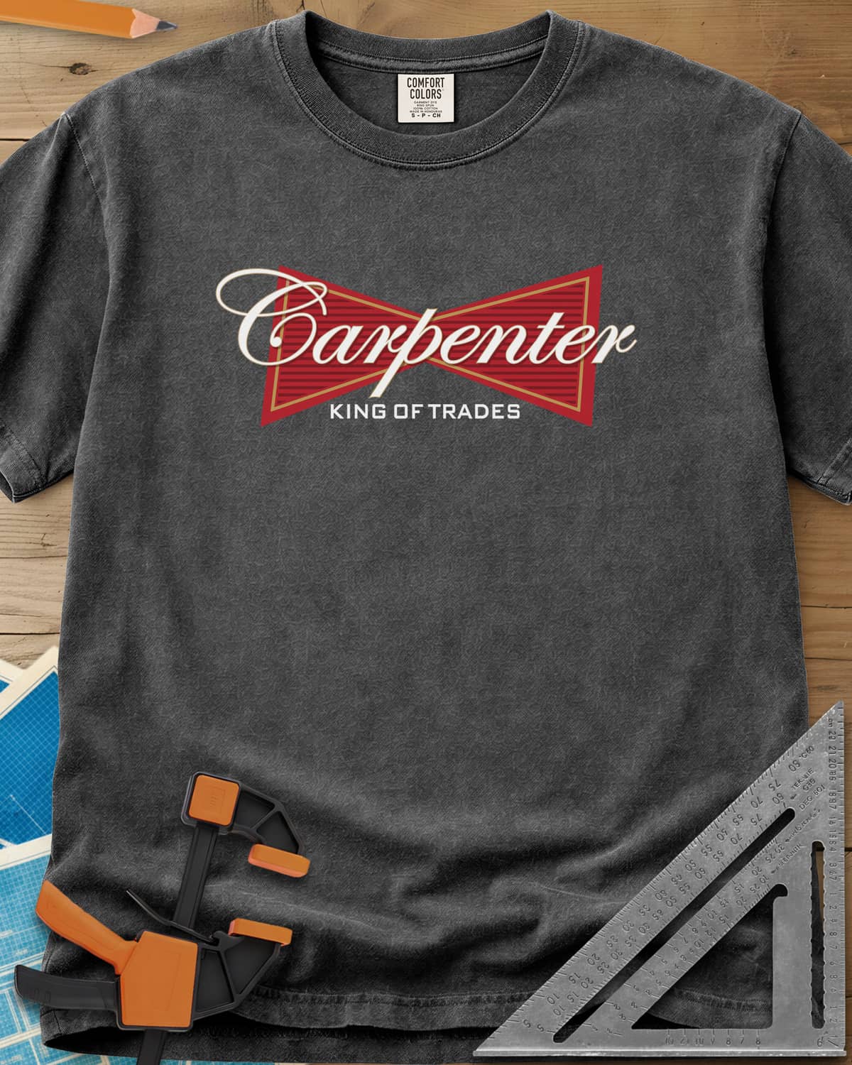 King of Trades heavyweight tee in Pepper, a red bow-tie badge with white script and gold trim