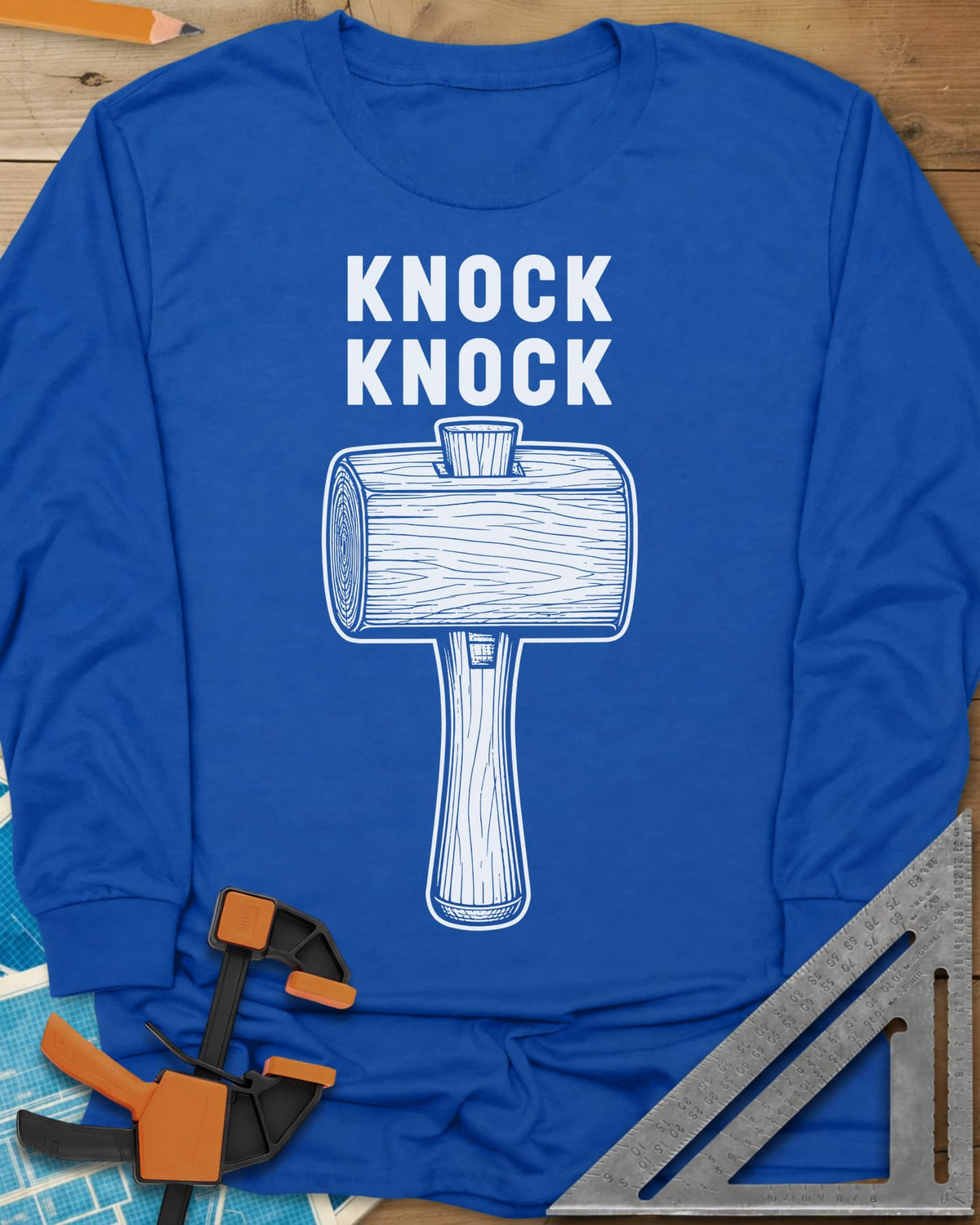 Knock Knock long sleeve shirt in Royal, a wooden mallet drawn in fine linework under two words
