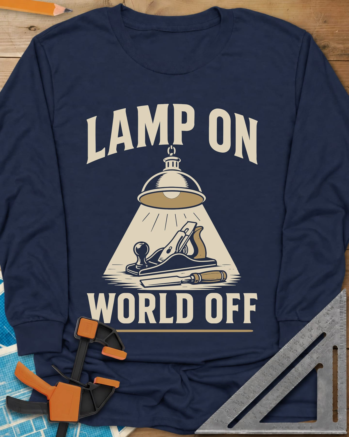 Lamp On World Off long sleeve shirt in Navy, a pendant shop lamp lighting a hand plane and chisel