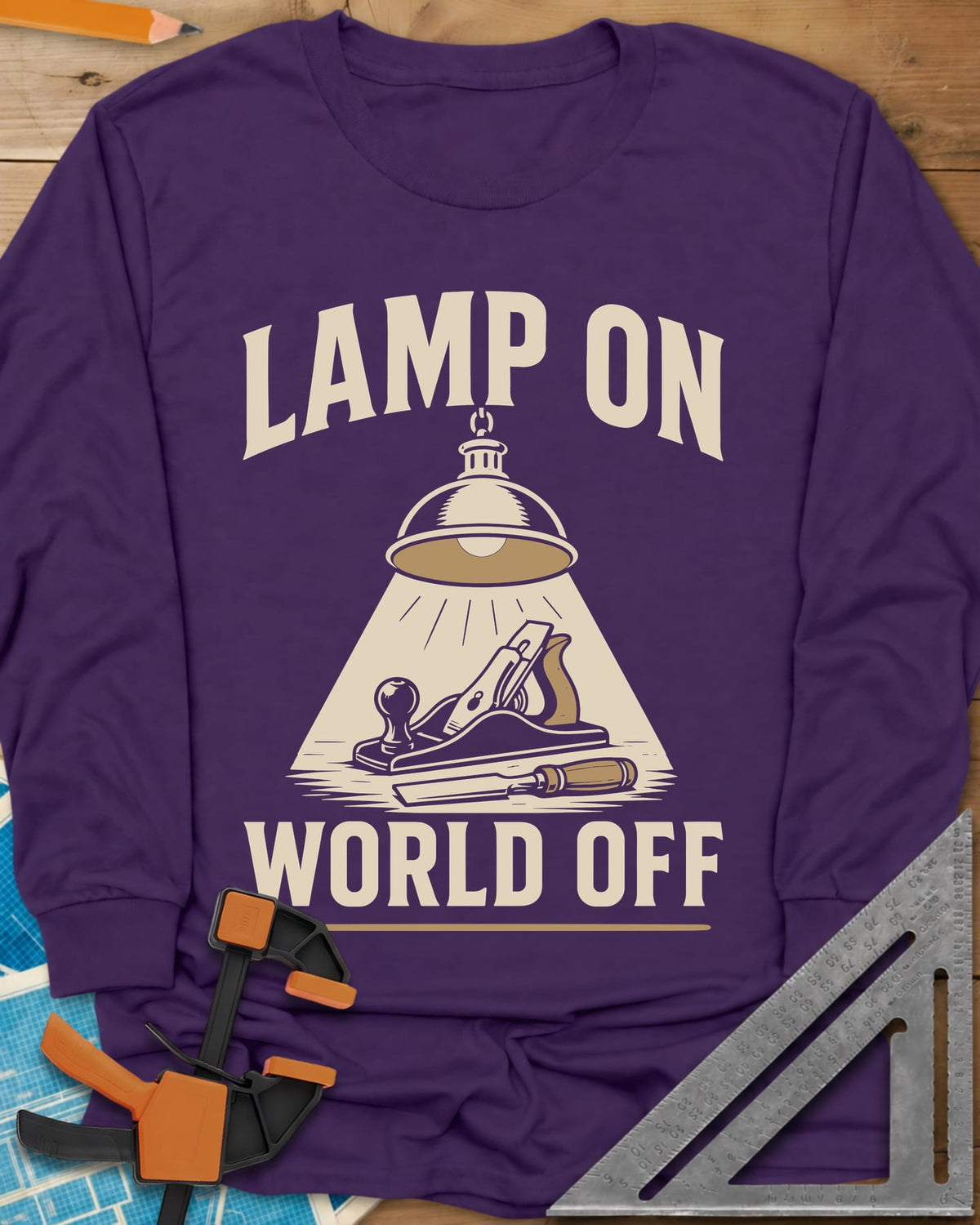 Lamp On World Off long sleeve shirt in Purple, a pendant shop lamp lighting a hand plane and chisel