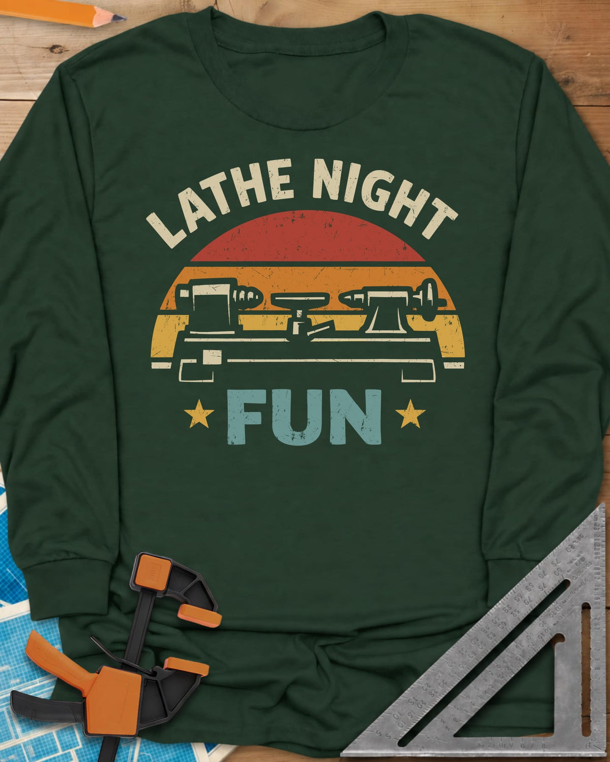 Lathe Night Fun long sleeve shirt in Forest Green, a retro striped sunset behind a wood lathe with stars