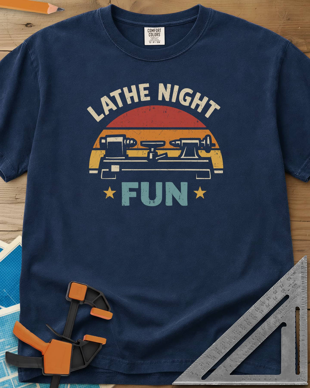 Lathe Night Fun heavyweight tee in Navy, a retro striped sunset behind a wood lathe with stars