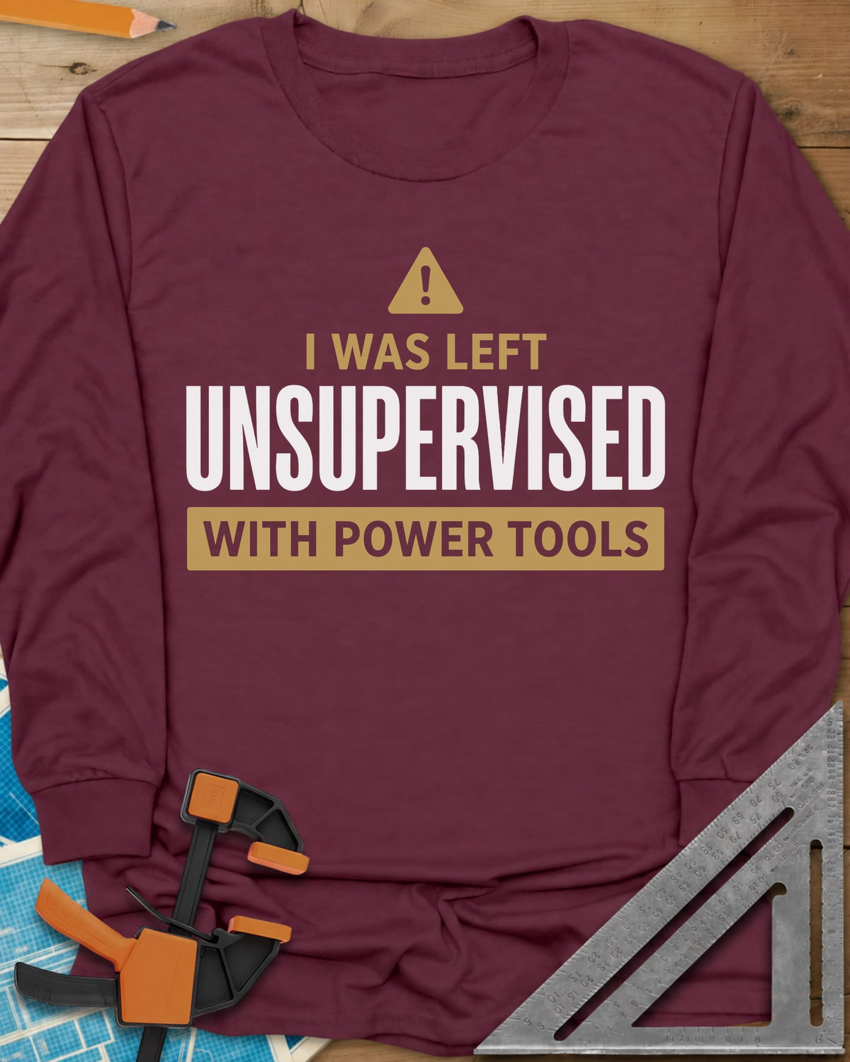 Left Unsupervised With Power Tools long sleeve shirt in Maroon, a warning triangle above bold lettering in a gold bar