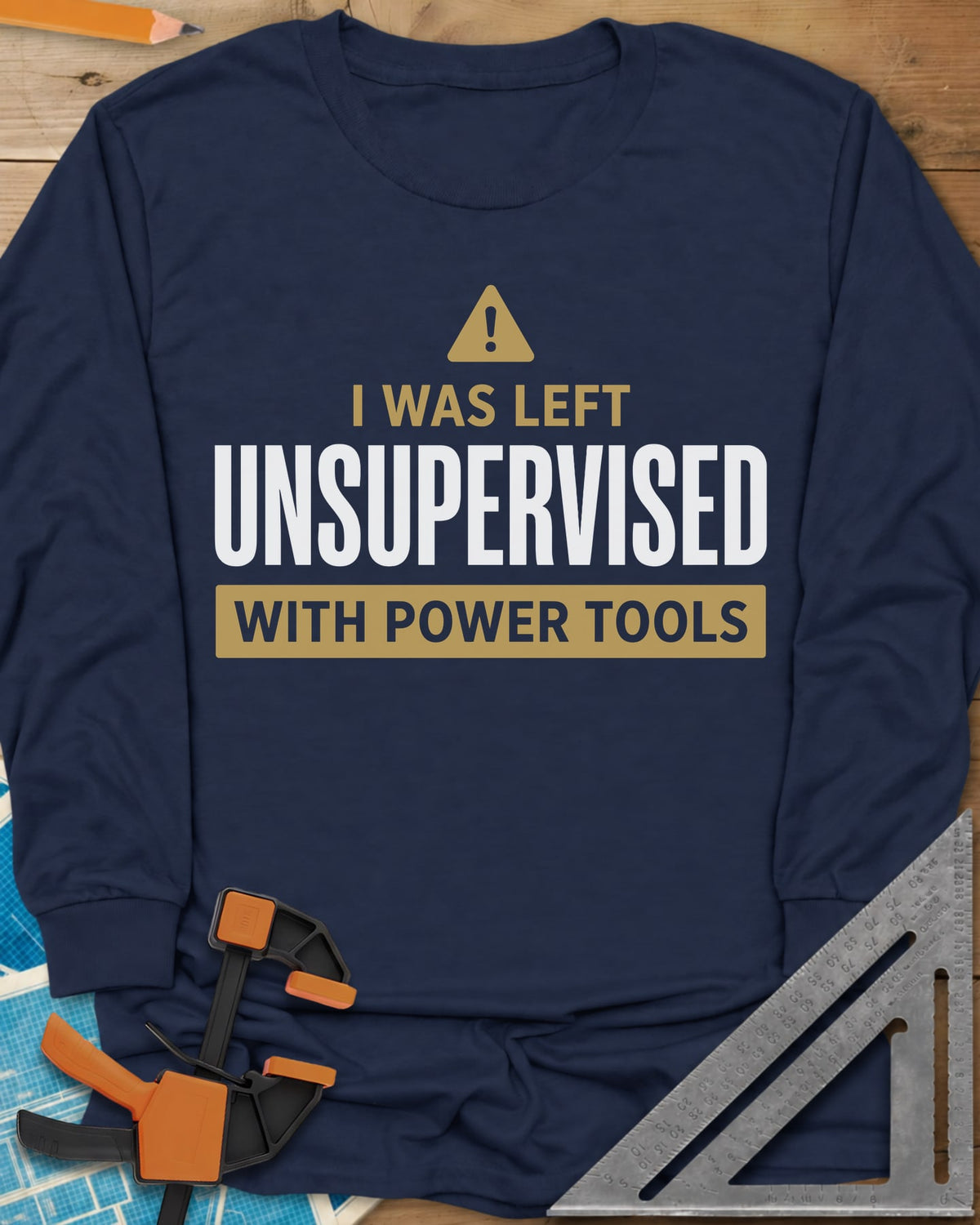 Left Unsupervised With Power Tools long sleeve shirt in Navy, a warning triangle above bold lettering in a gold bar