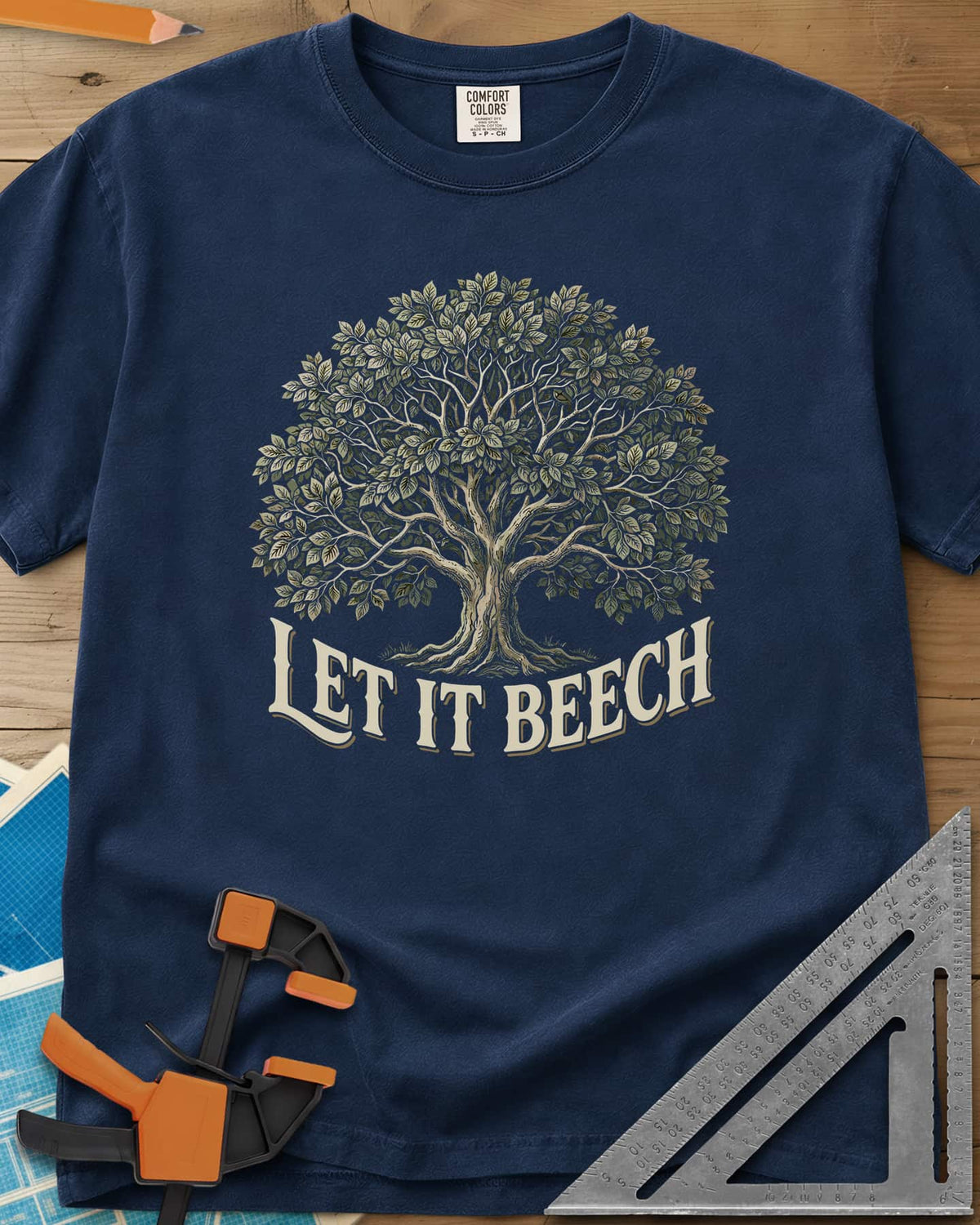 Let It Beech heavyweight tee in Navy, a detailed beech tree in full leaf above curved cream lettering