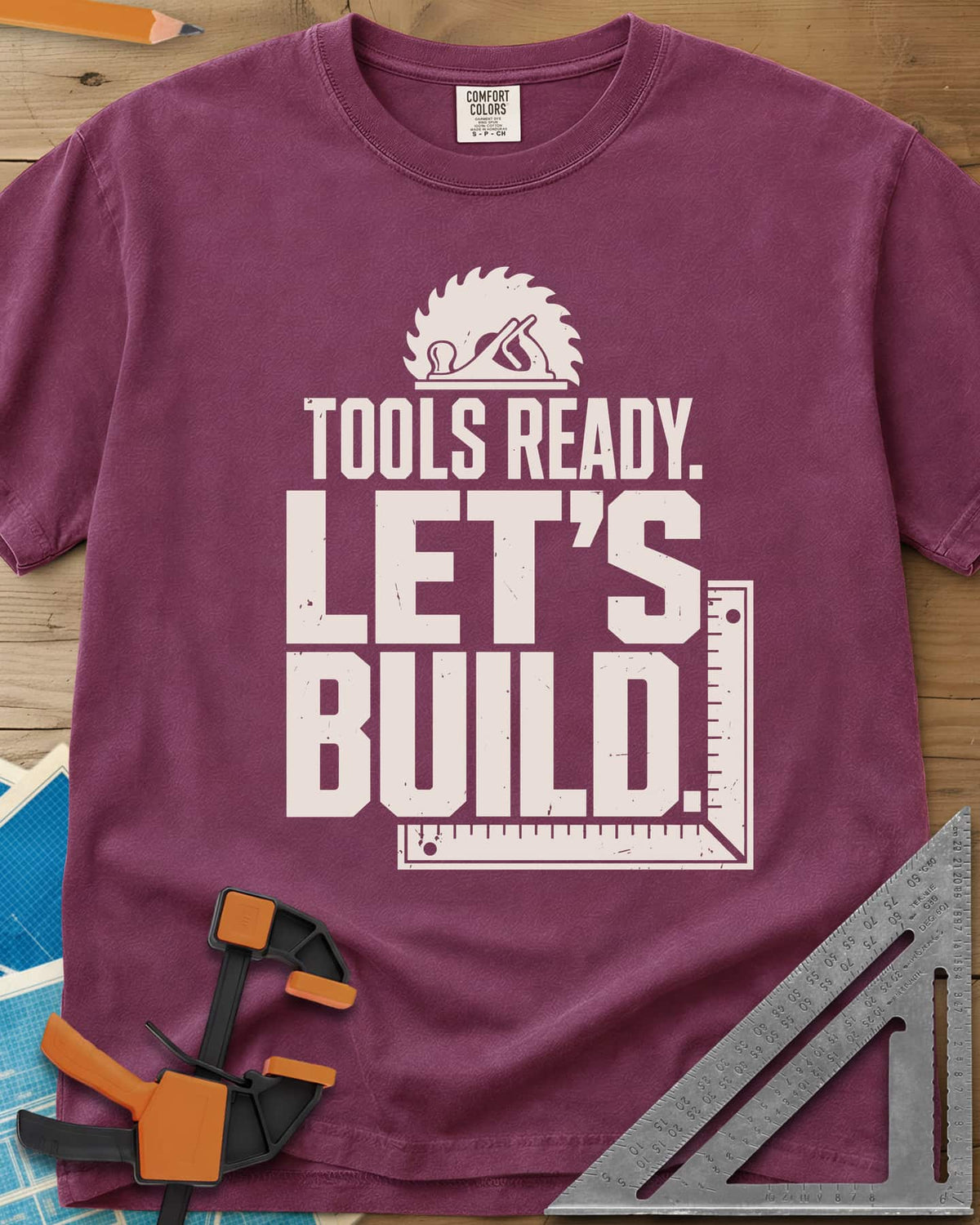 Let'S Build heavyweight tee in Berry, a saw blade and hand plane over a framing square