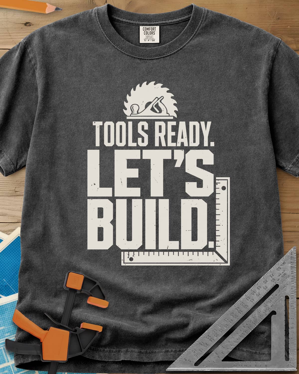 Let'S Build heavyweight tee in Pepper, a saw blade and hand plane over a framing square