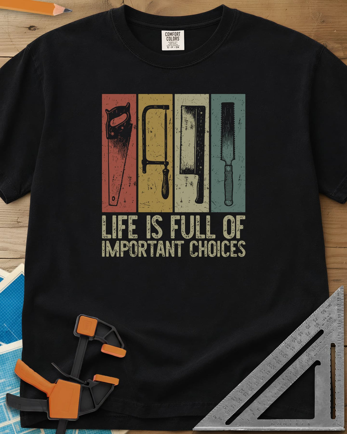 Life Is Full Of Important Choices heavyweight tee in Black, four hand saws in rust, mustard, cream and teal panels