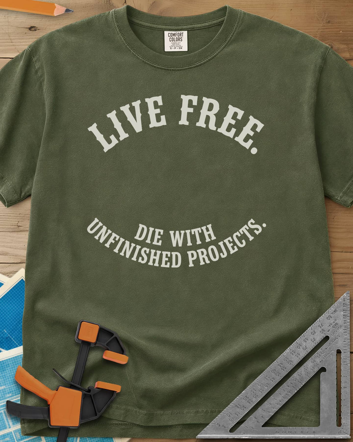 Live Free heavyweight tee in Hemp, two curved lines of slab-serif capitals, no graphic