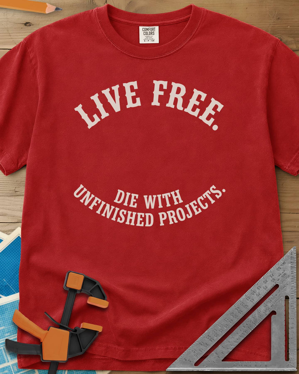 Live Free heavyweight tee in Red, two curved lines of slab-serif capitals, no graphic