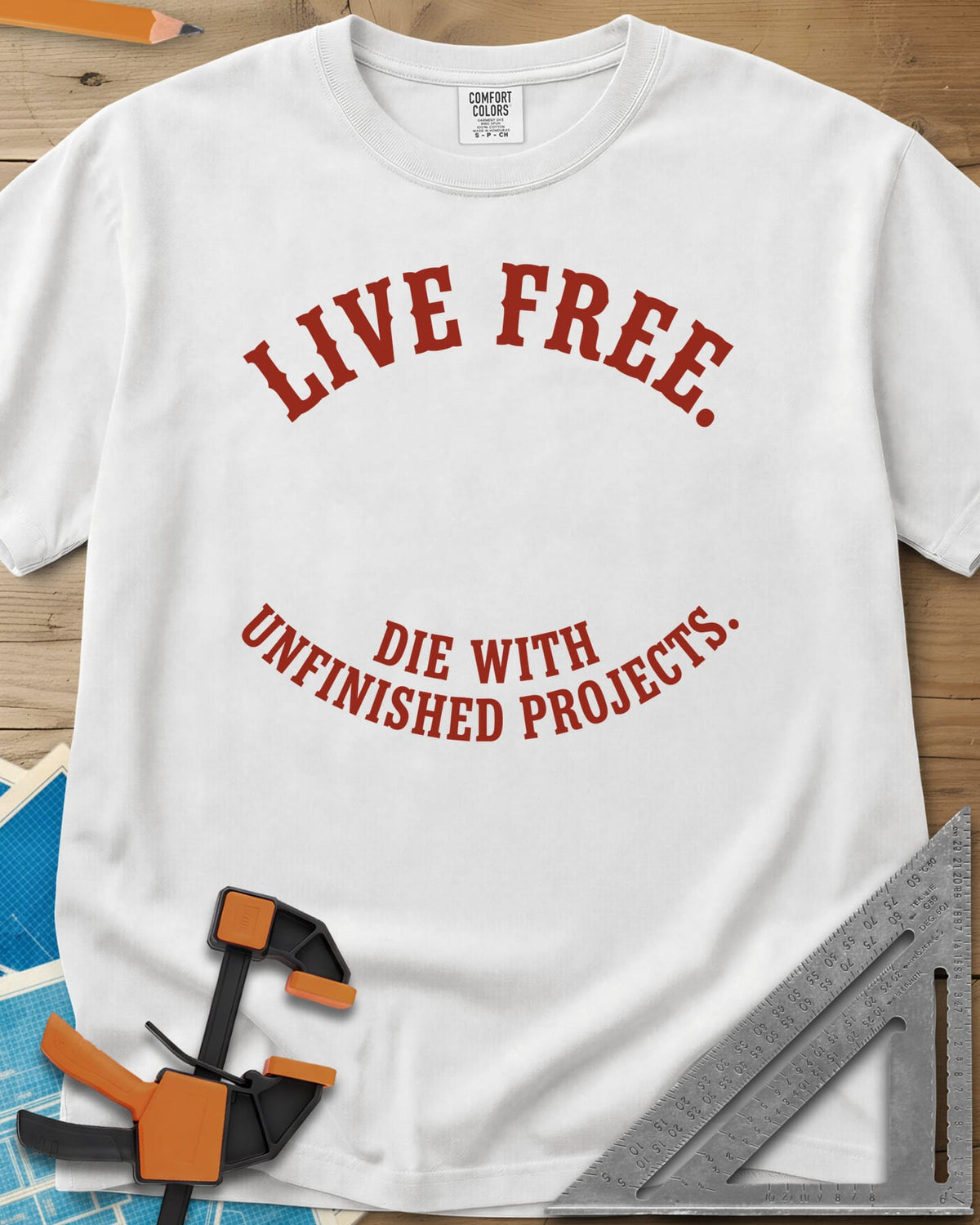 Live Free heavyweight tee in White, two curved lines of slab-serif capitals, no graphic