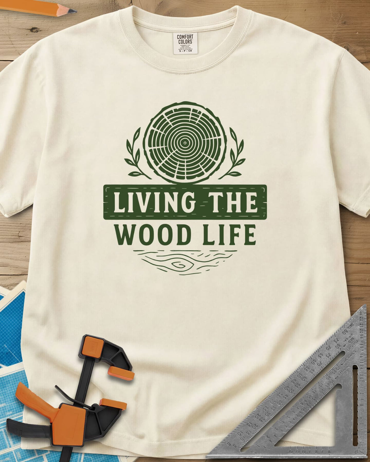 Living The Wood Life heavyweight tee in Ivory, a log slice with laurel sprigs and a plank banner