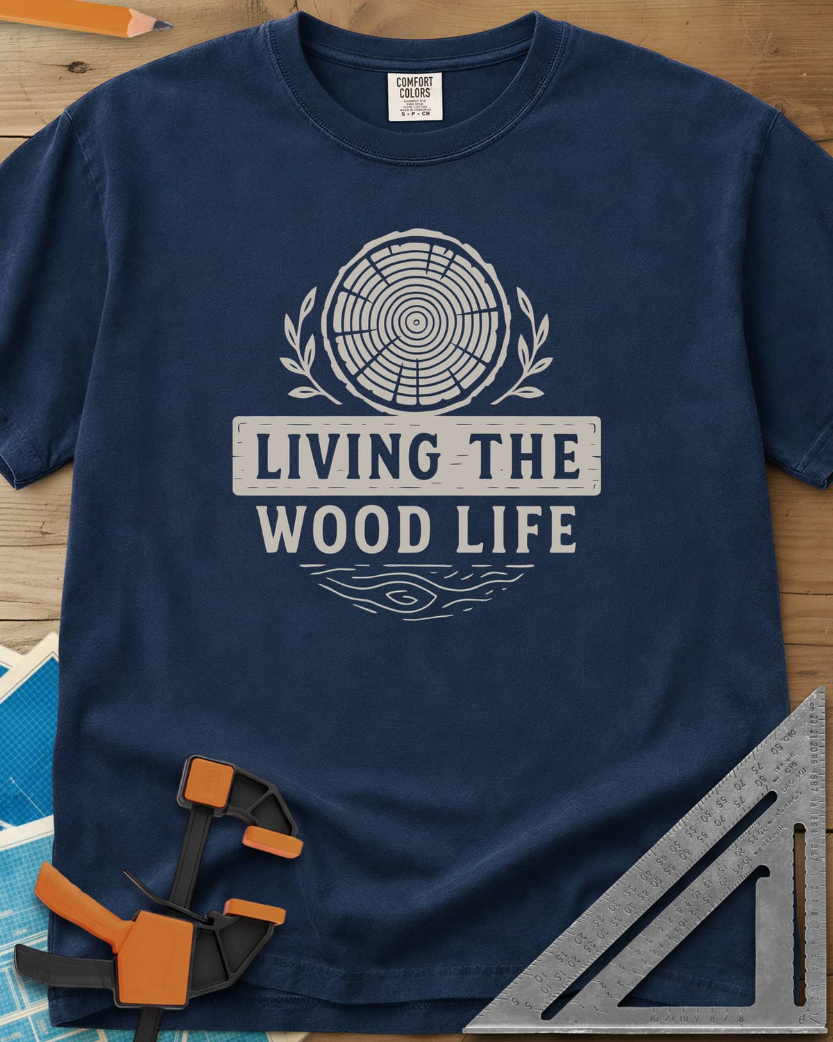 Living The Wood Life heavyweight tee in Navy, a log slice with laurel sprigs and a plank banner