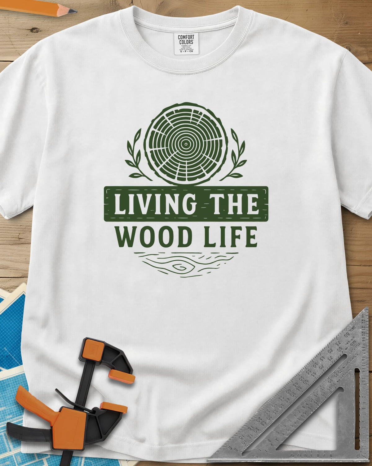 Living The Wood Life heavyweight tee in White, a log slice with laurel sprigs and a plank banner