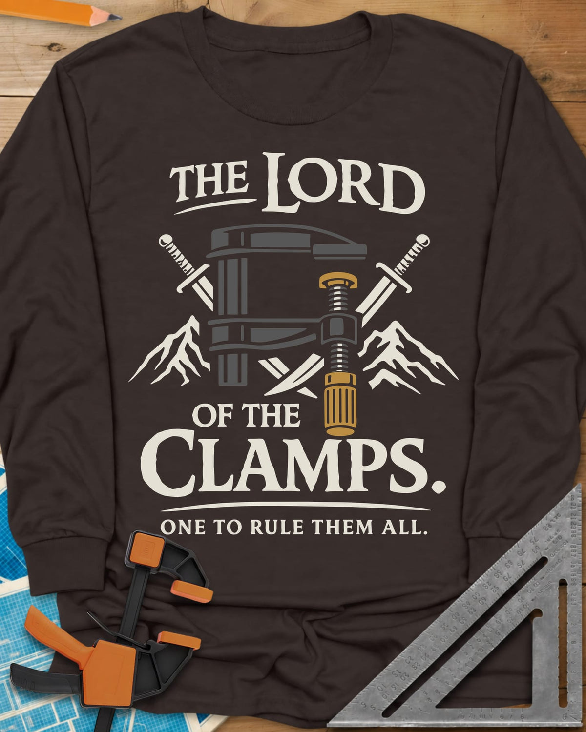 Lord Of The Clamps long sleeve shirt in Dark Chocolate, a bar clamp between crossed swords and snowy mountain peaks