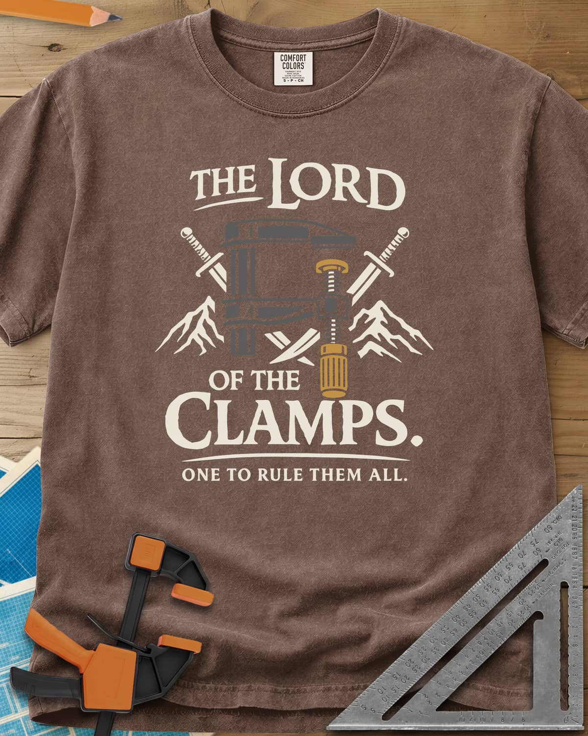 Lord Of The Clamps heavyweight tee in Espresso, a bar clamp between crossed swords and snowy mountain peaks