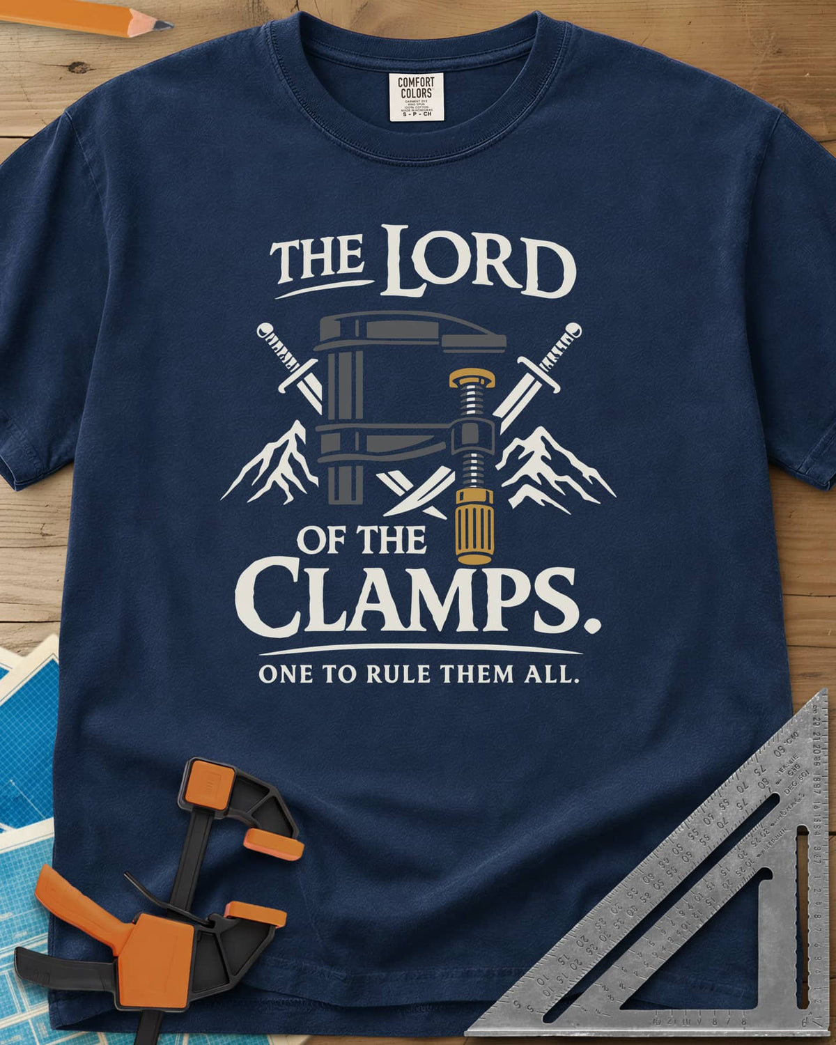Lord Of The Clamps heavyweight tee in Navy, a bar clamp between crossed swords and snowy mountain peaks