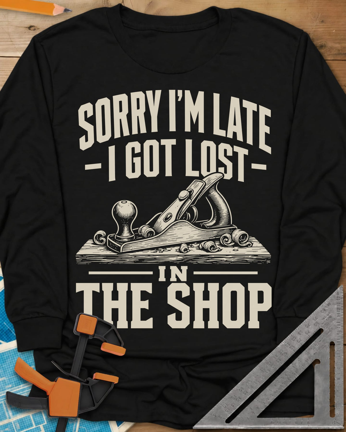 Lost In The Shop long sleeve shirt in Black, a bench hand plane on a board among curled shavings