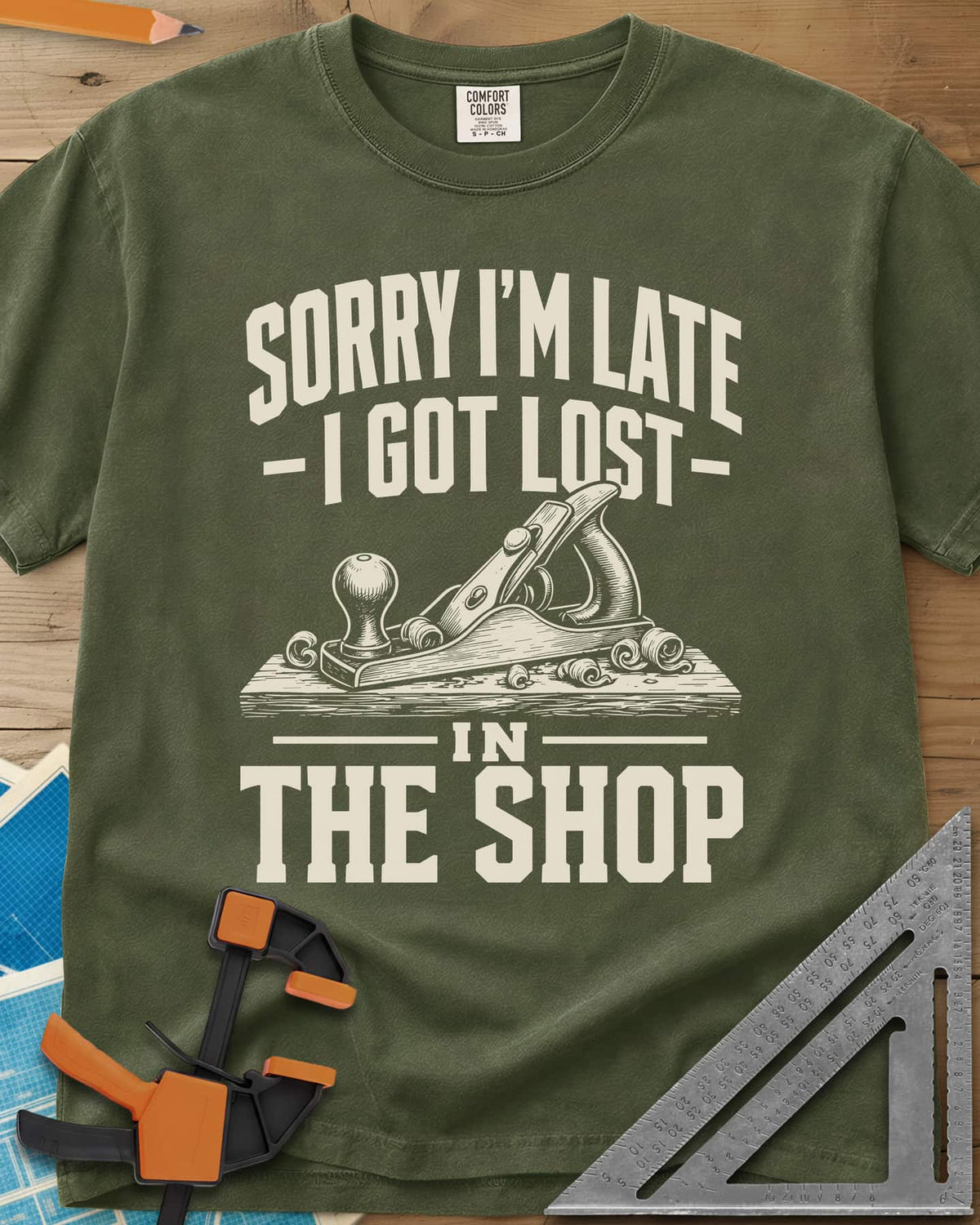 Lost In The Shop heavyweight tee in Hemp, a bench hand plane on a board among curled shavings