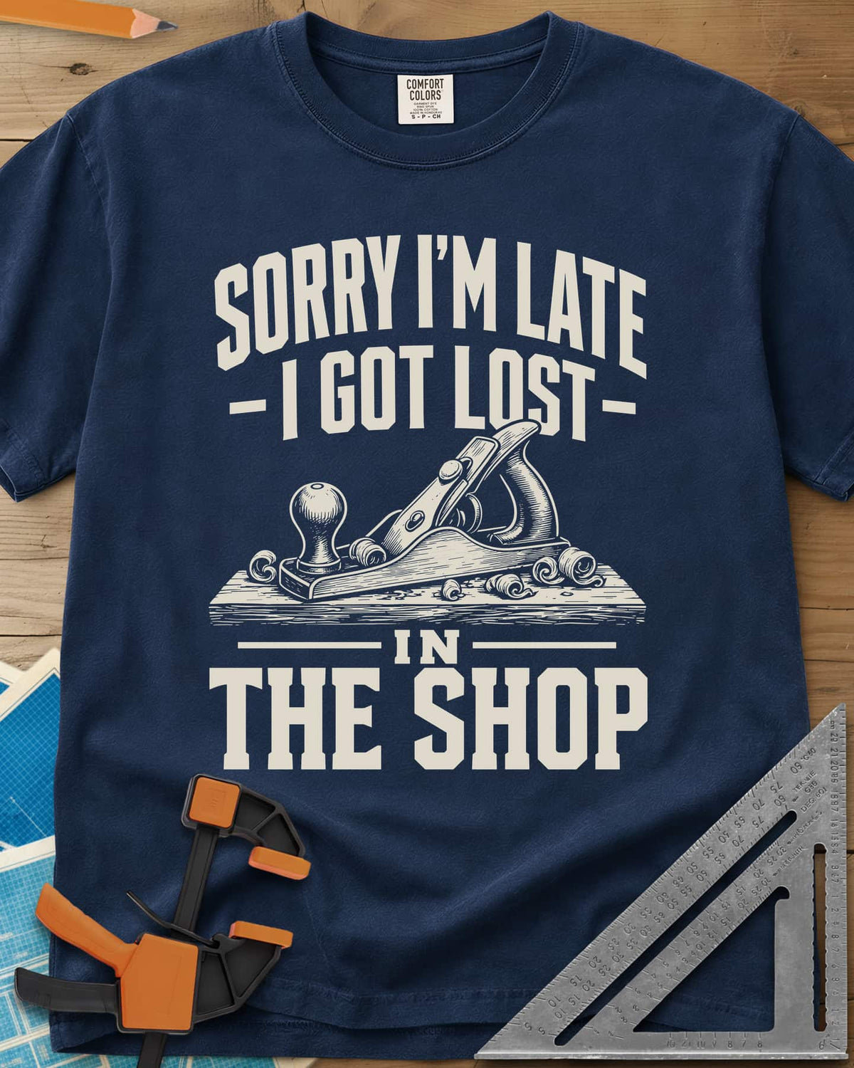 Lost In The Shop heavyweight tee in Navy, a bench hand plane on a board among curled shavings