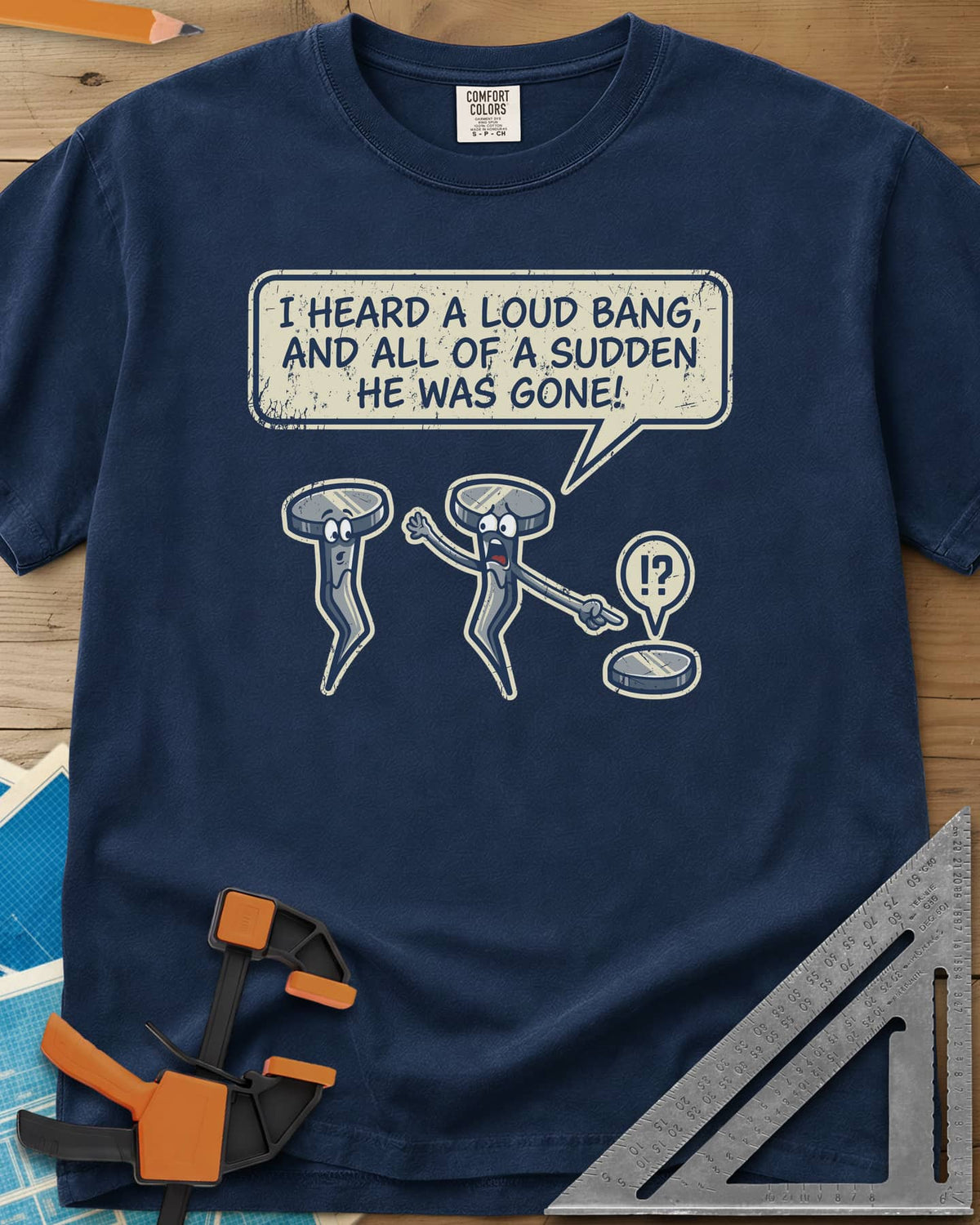 Loud Bang heavyweight tee in Navy, two cartoon nails, one pointing at a lone nail head on the ground