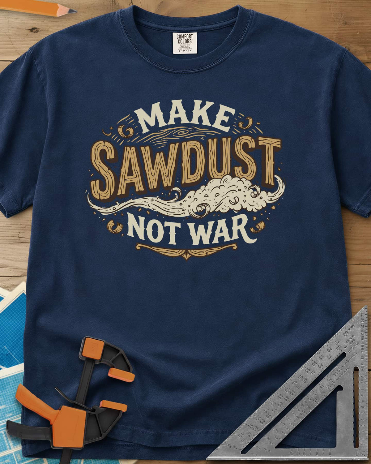 Make Sawdust Not War heavyweight tee in Navy, vintage badge lettering with a swirl of blowing sawdust