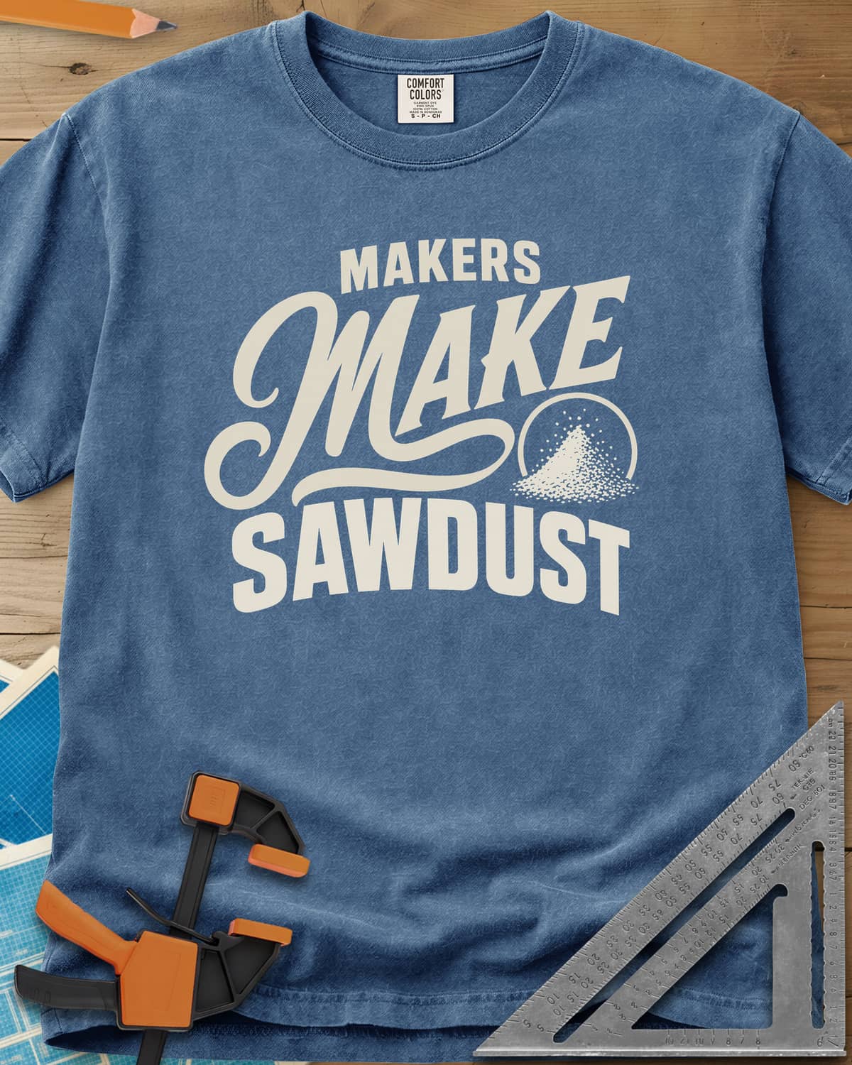Make Sawdust heavyweight tee in Blue Jean, bold lettering with a script MAKE and a small pile of sawdust