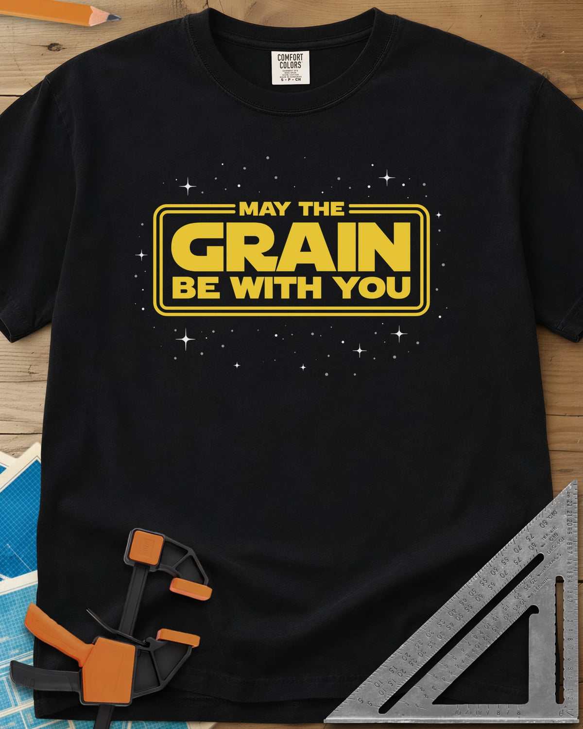 May The Grain Be With You heavyweight tee in Black, yellow movie-title lettering in a double frame over a starfield
