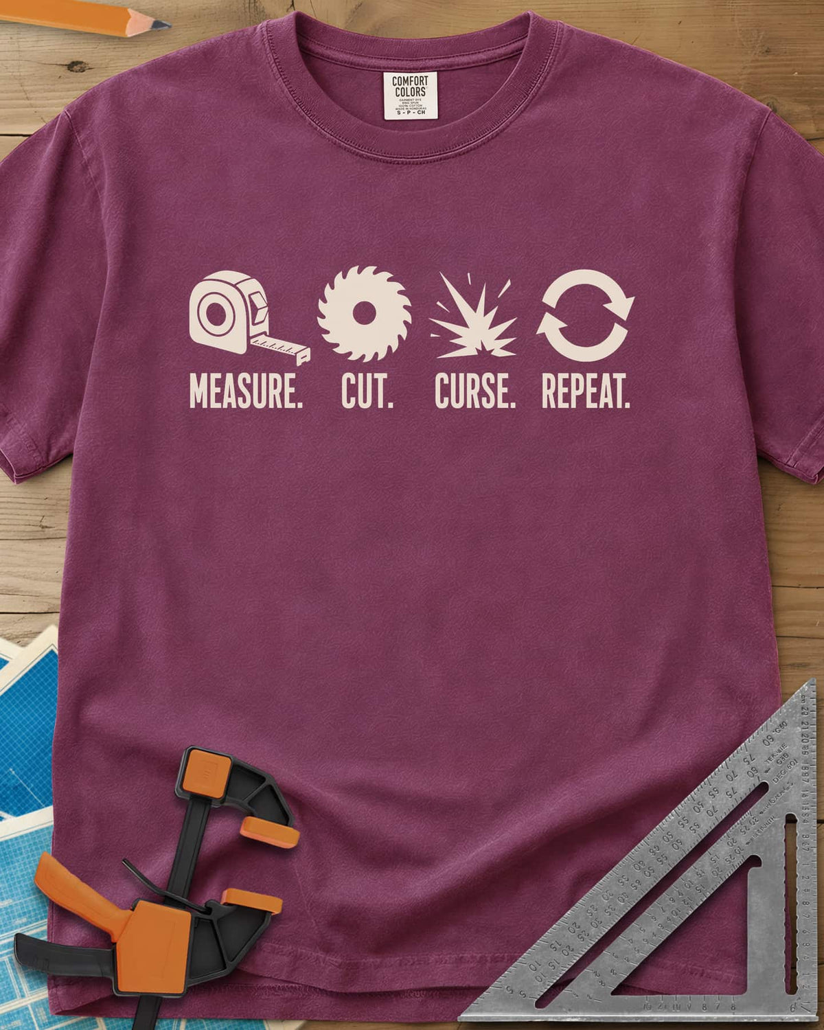 Measure Cut Repeat heavyweight tee in Berry, four icons: tape measure, saw blade, spark burst, repeat arrows