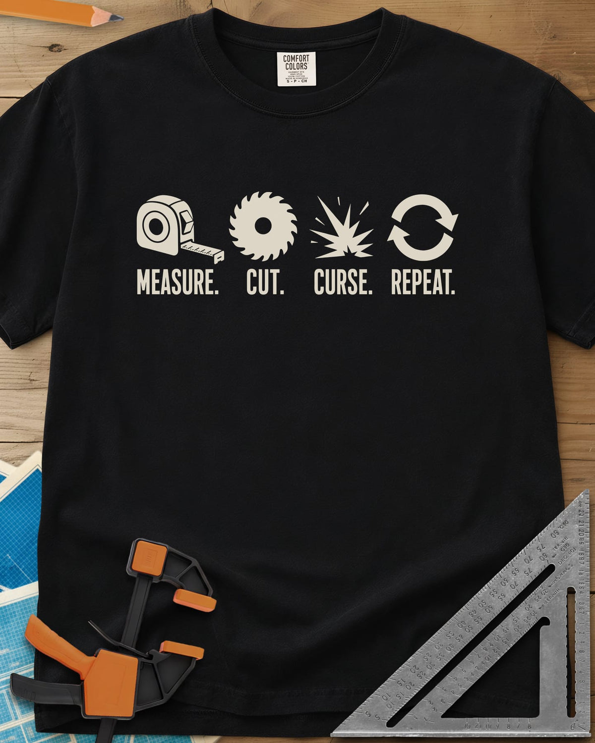 Measure Cut Repeat heavyweight tee in Black, four icons: tape measure, saw blade, spark burst, repeat arrows