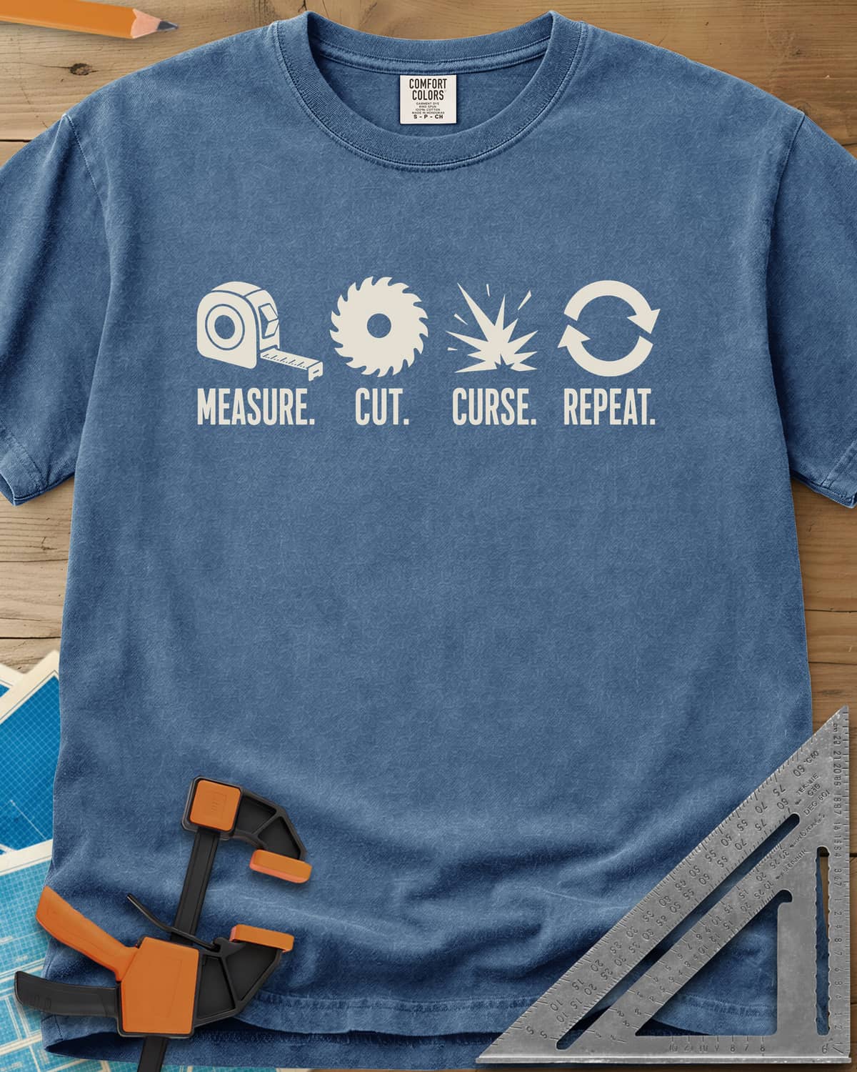 Measure Cut Repeat heavyweight tee in Blue Jean, four icons: tape measure, saw blade, spark burst, repeat arrows