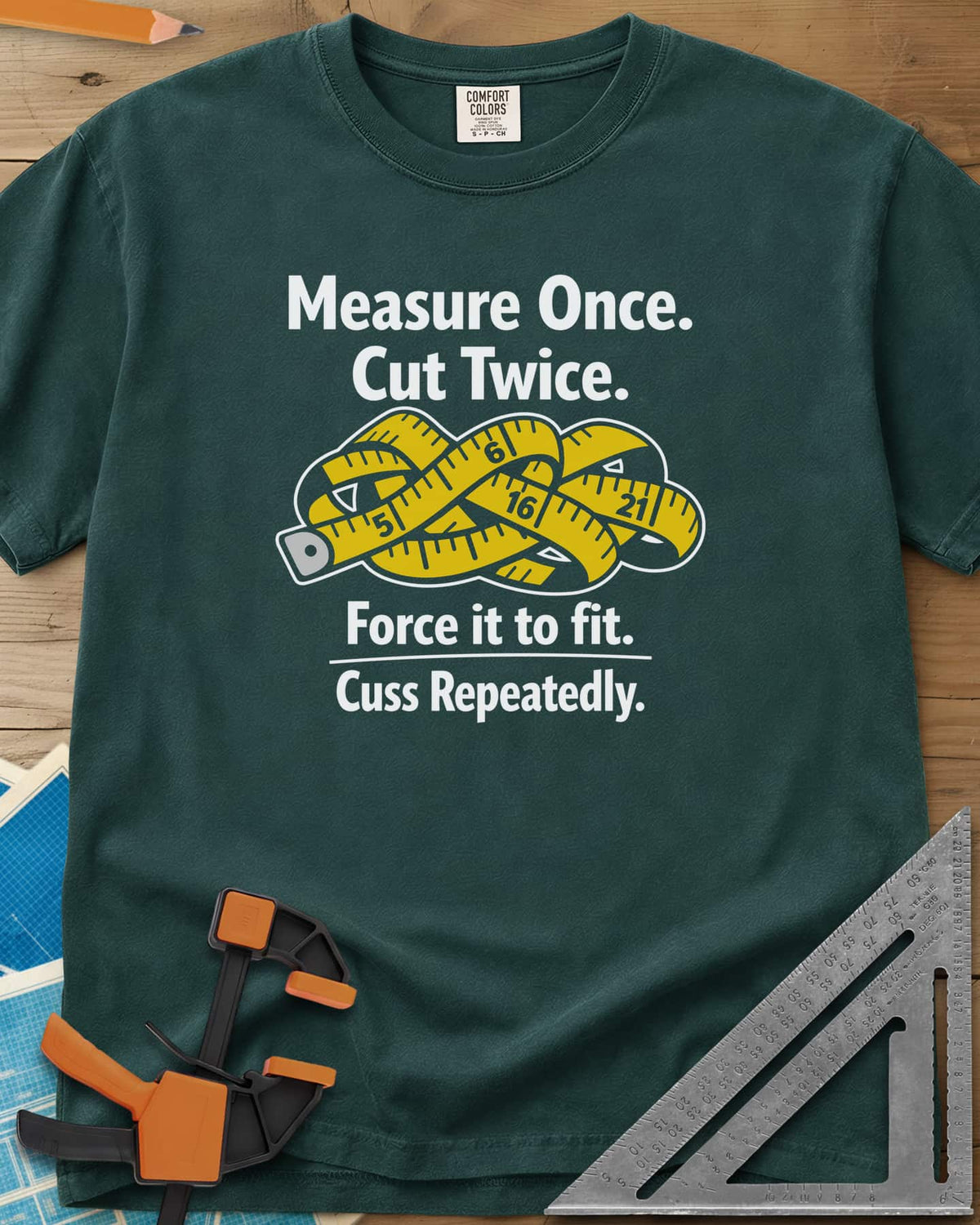 Measure Once heavyweight tee in Blue Spruce, a yellow tape measure tied in a knot