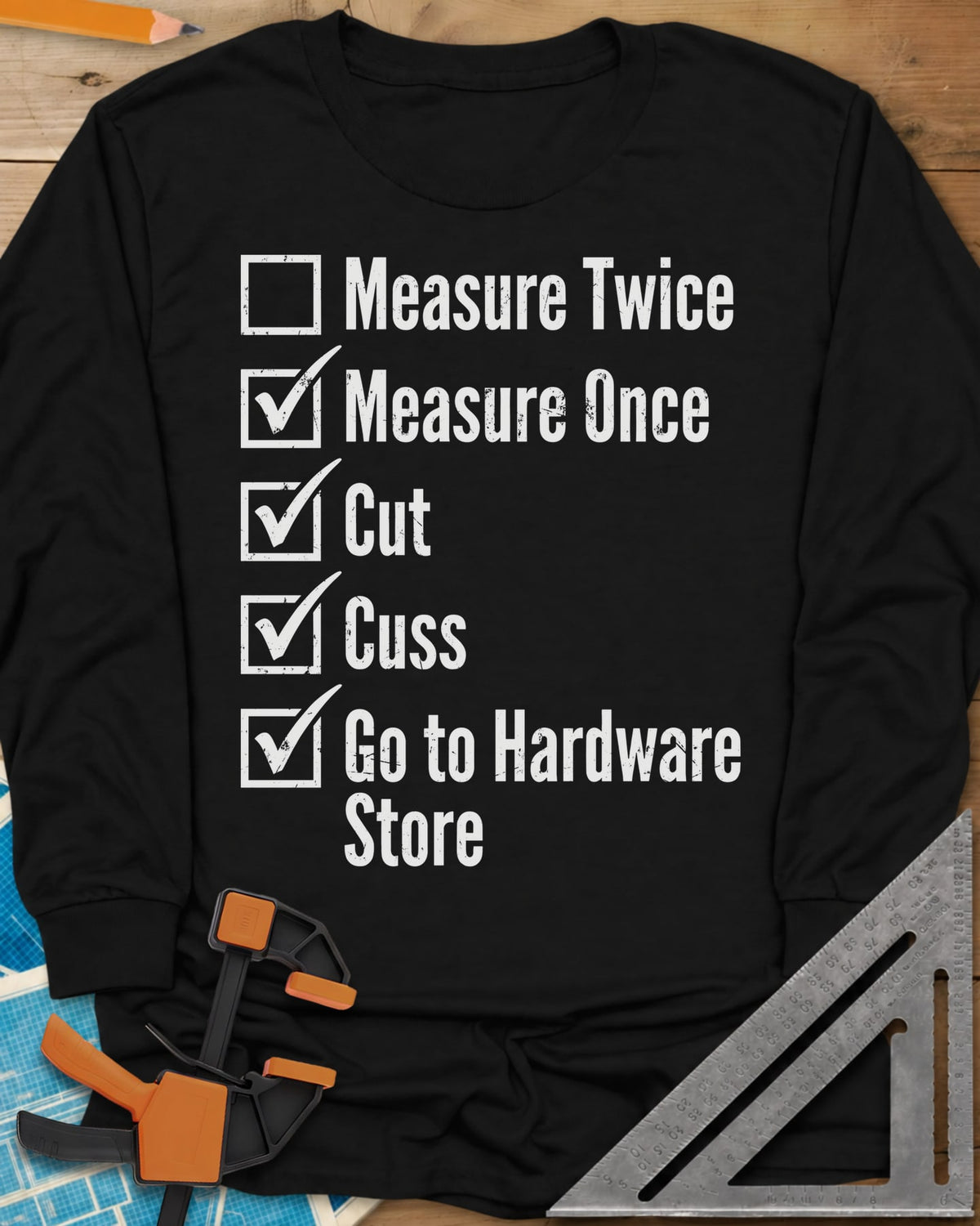 Measure Twice Checkbox long sleeve shirt in Black, a five-line checklist with only the measure twice box left empty
