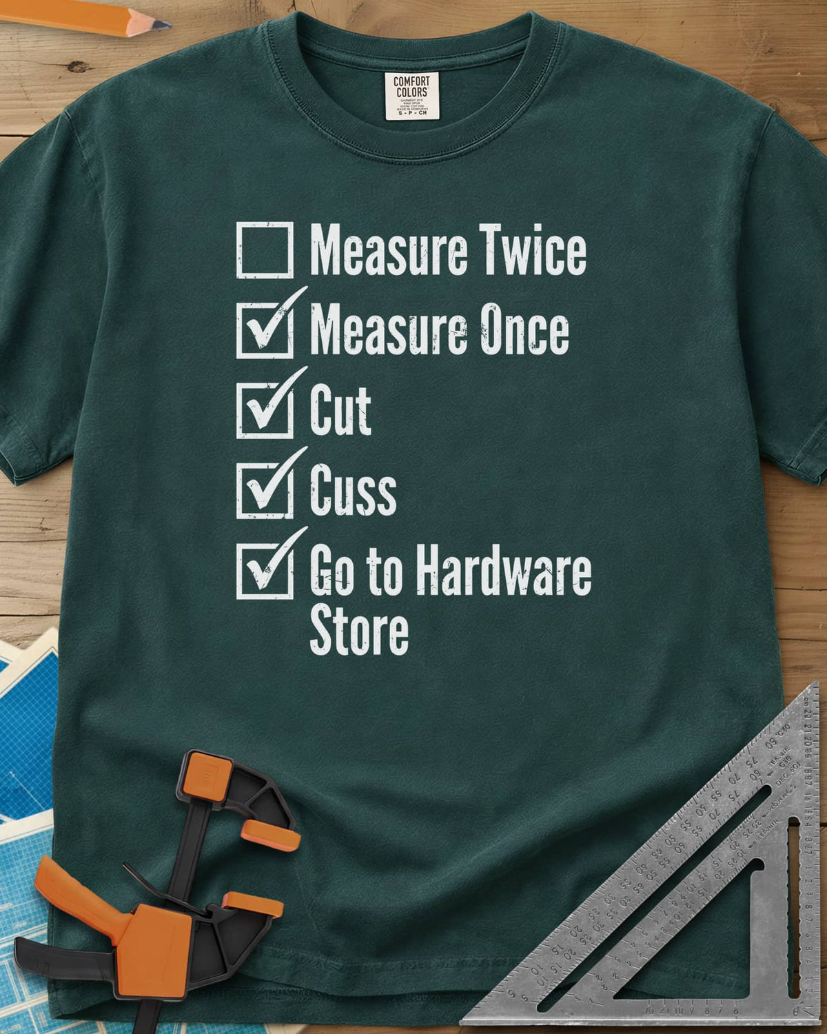 Measure Twice Checkbox heavyweight tee in Blue Spruce, a five-line checklist with only the measure twice box left empty