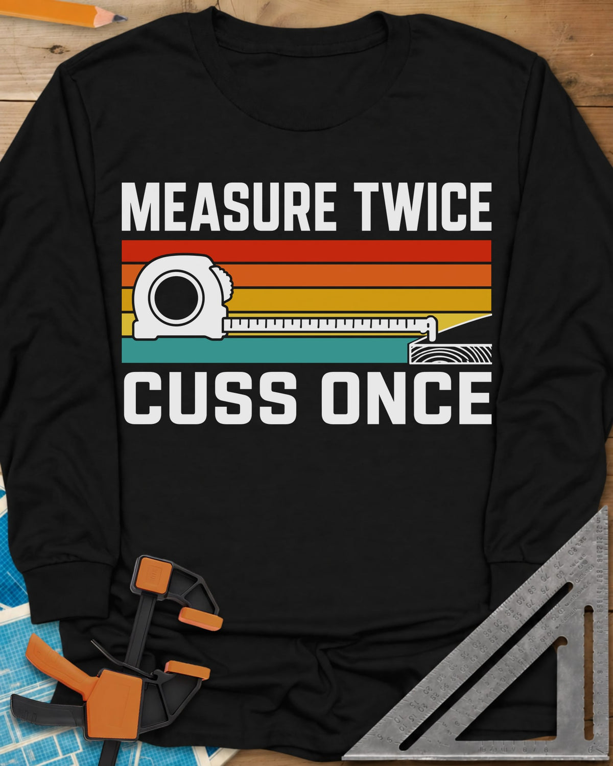 Measure Twice Cuss Once long sleeve shirt in Black, a white tape measure across retro red, orange, gold and teal stripes