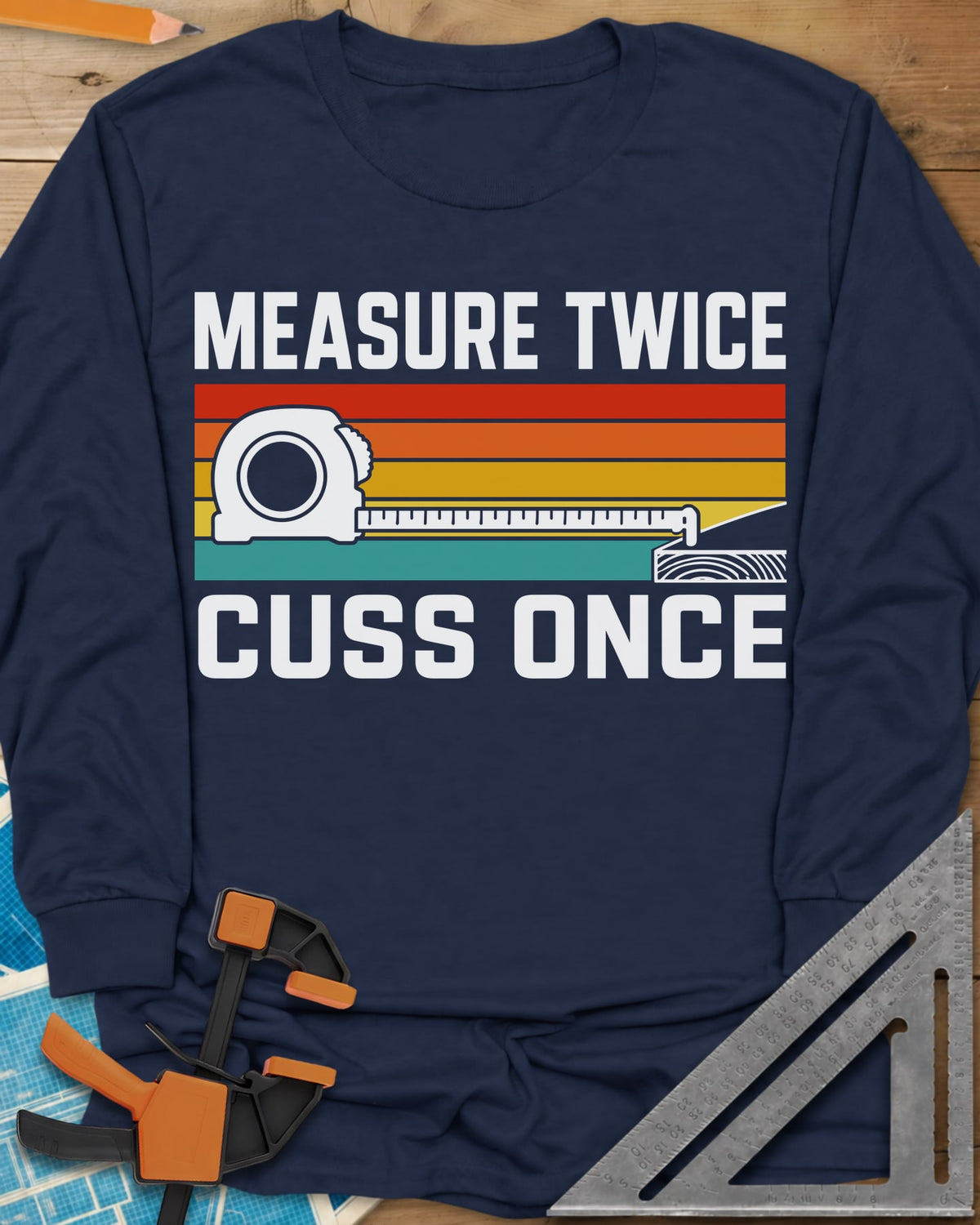 Measure Twice Cuss Once long sleeve shirt in Navy, a white tape measure across retro red, orange, gold and teal stripes