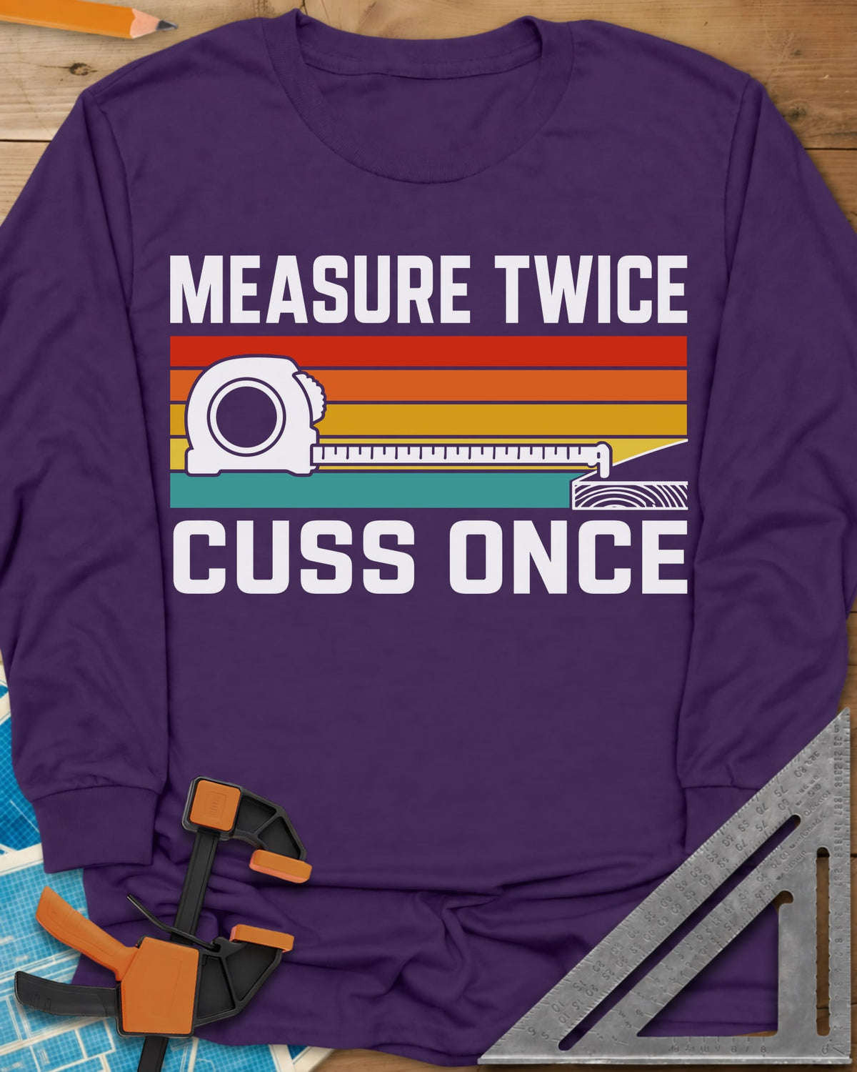 Measure Twice Cuss Once long sleeve shirt in Purple, a white tape measure across retro red, orange, gold and teal stripes