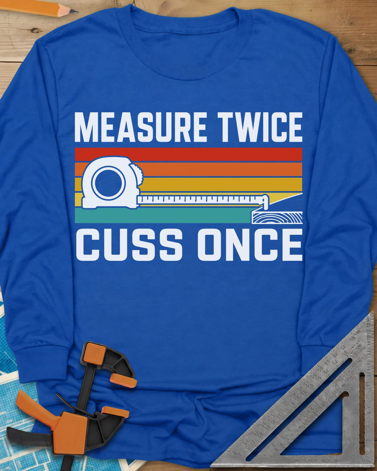 Measure Twice Cuss Once long sleeve shirt in Royal, a white tape measure across retro red, orange, gold and teal stripes