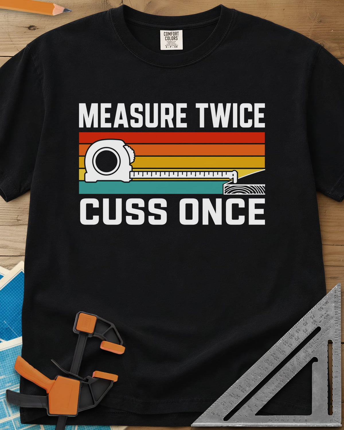 Measure Twice Cuss Once heavyweight tee in Black, a white tape measure across retro red, orange, gold and teal stripes