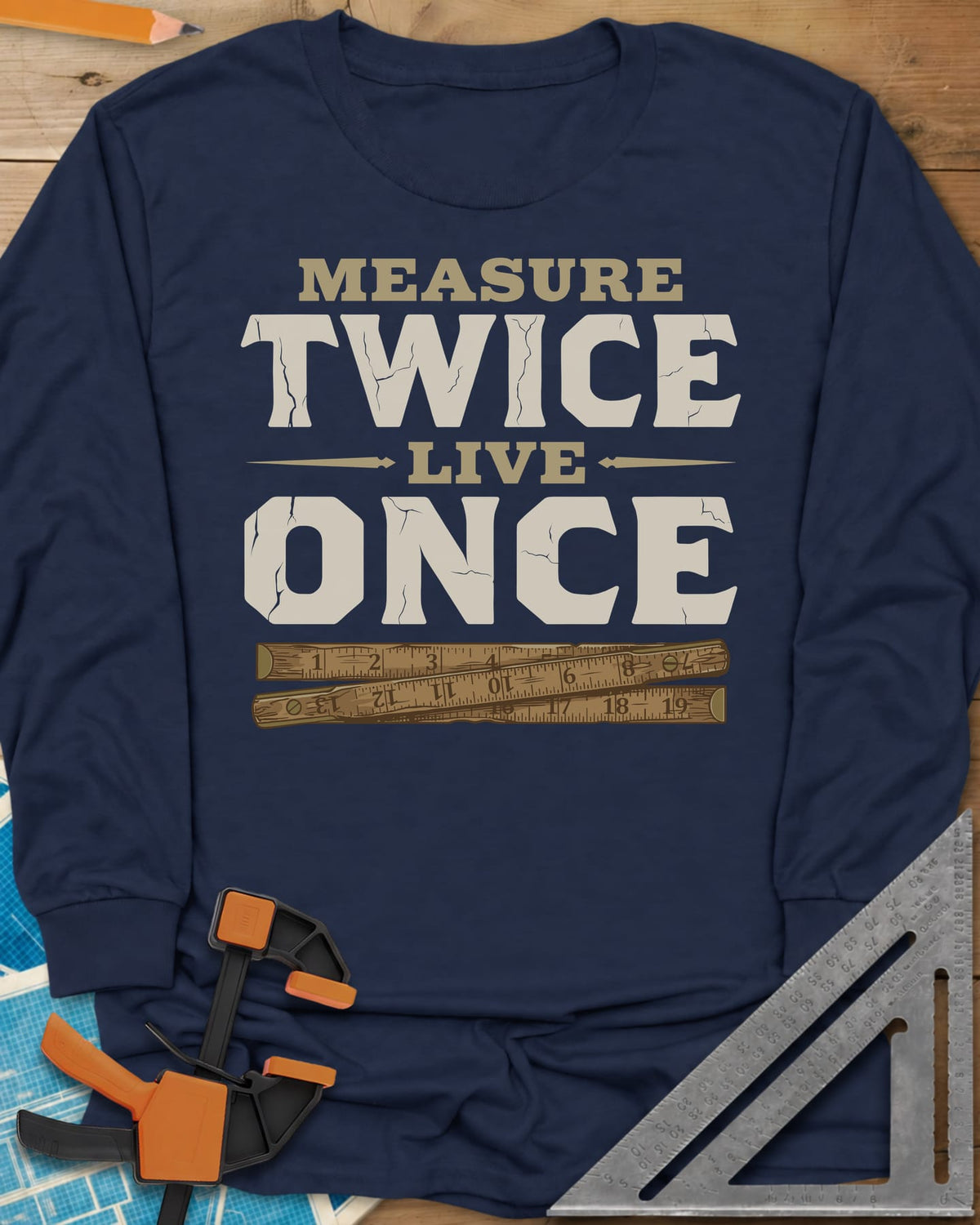 Measure Twice Live Once long sleeve shirt in Navy, cracked block letters above a worn wooden folding rule