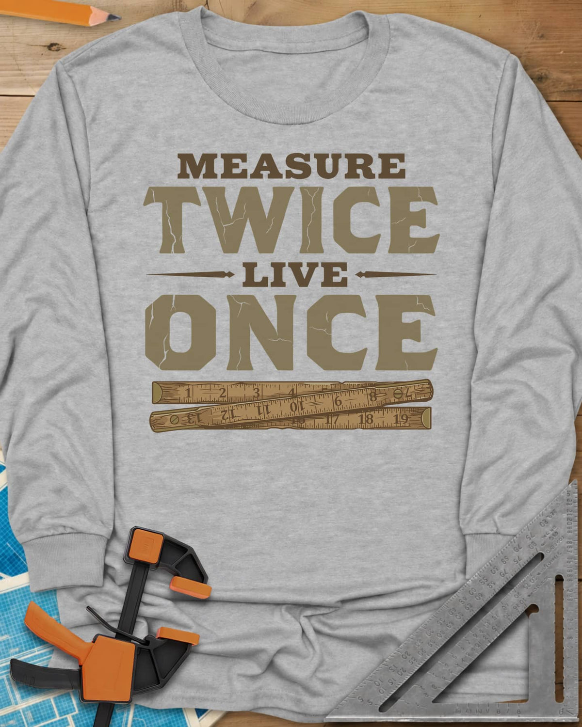 Measure Twice Live Once long sleeve shirt in Sport Grey, cracked block letters above a worn wooden folding rule