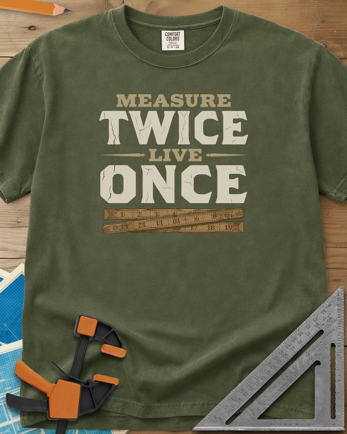 Measure Twice Live Once heavyweight tee in Hemp, cracked block letters above a worn wooden folding rule