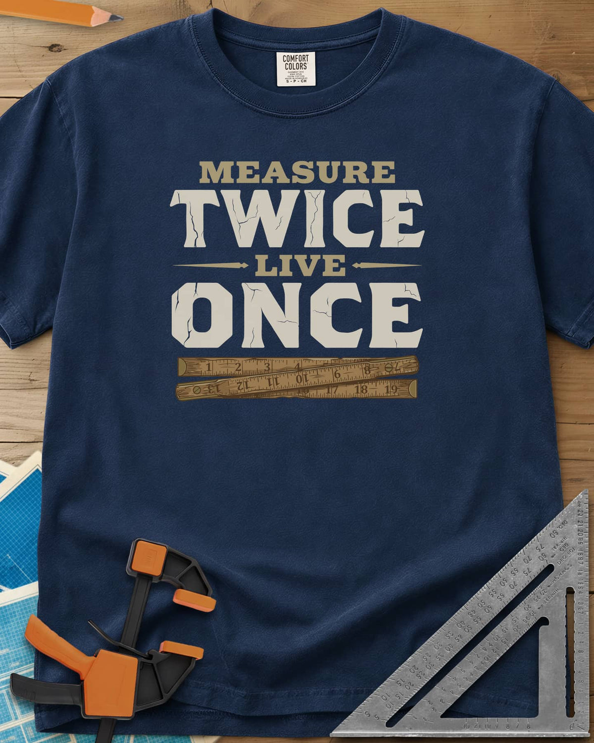 Measure Twice Live Once heavyweight tee in Navy, cracked block letters above a worn wooden folding rule