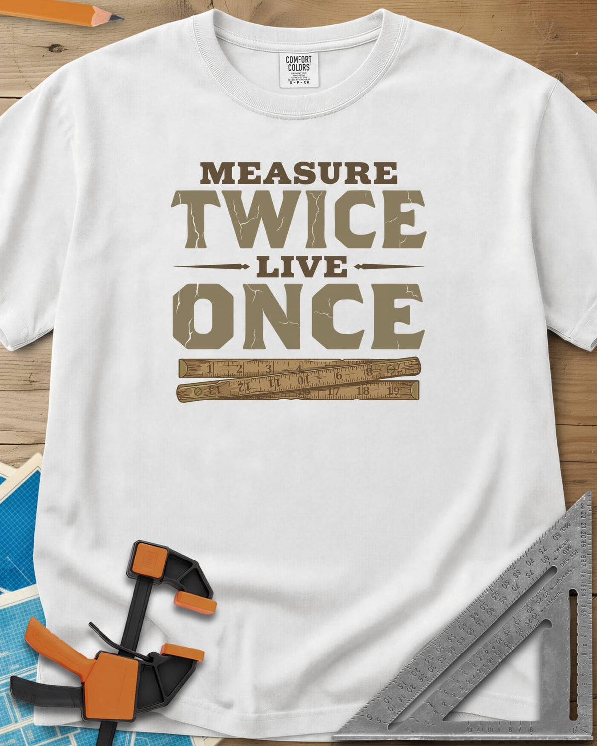 Measure Twice Live Once heavyweight tee in White, cracked block letters above a worn wooden folding rule