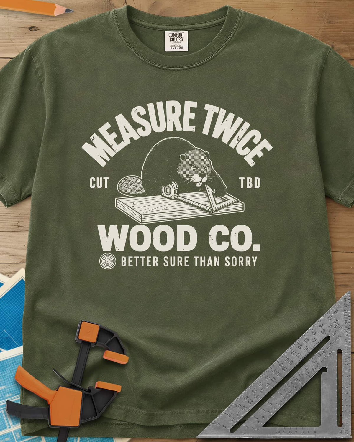 Measure Twice heavyweight tee in Hemp, a determined beaver measuring a board in a Wood Co. badge