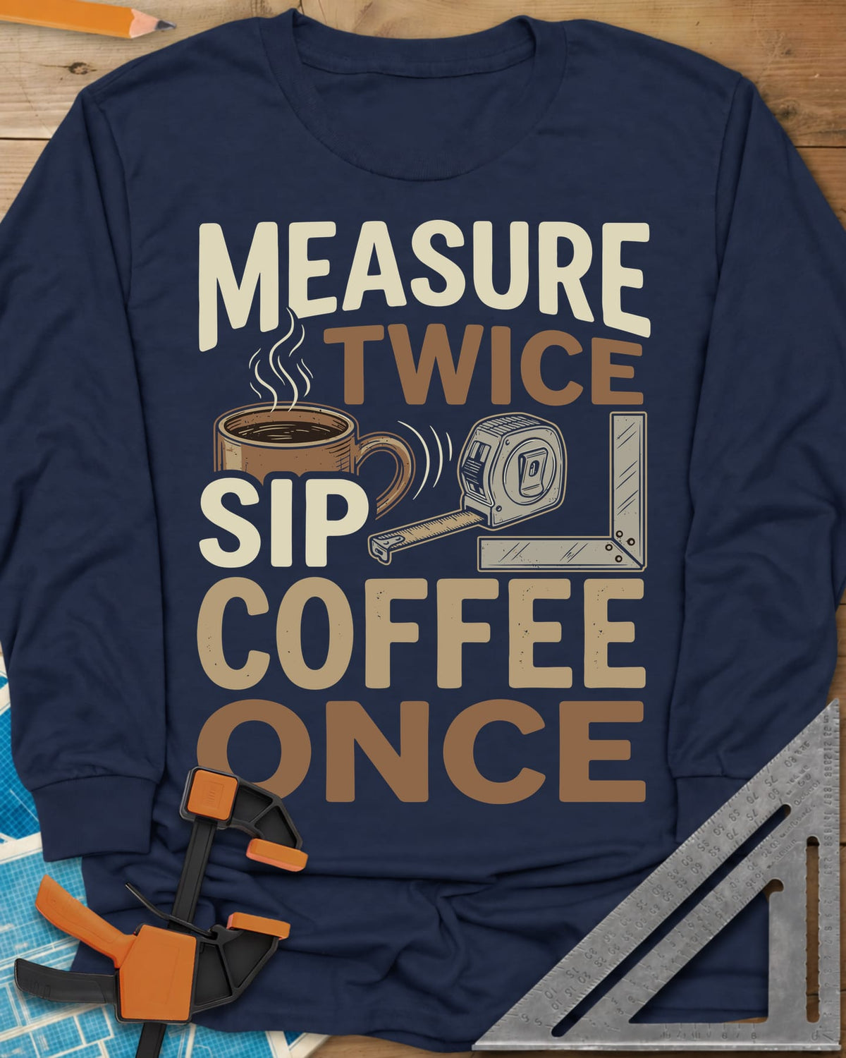 Measure Twice Sip Coffee Once long sleeve shirt in Navy, stacked lettering with a coffee mug, tape measure and square
