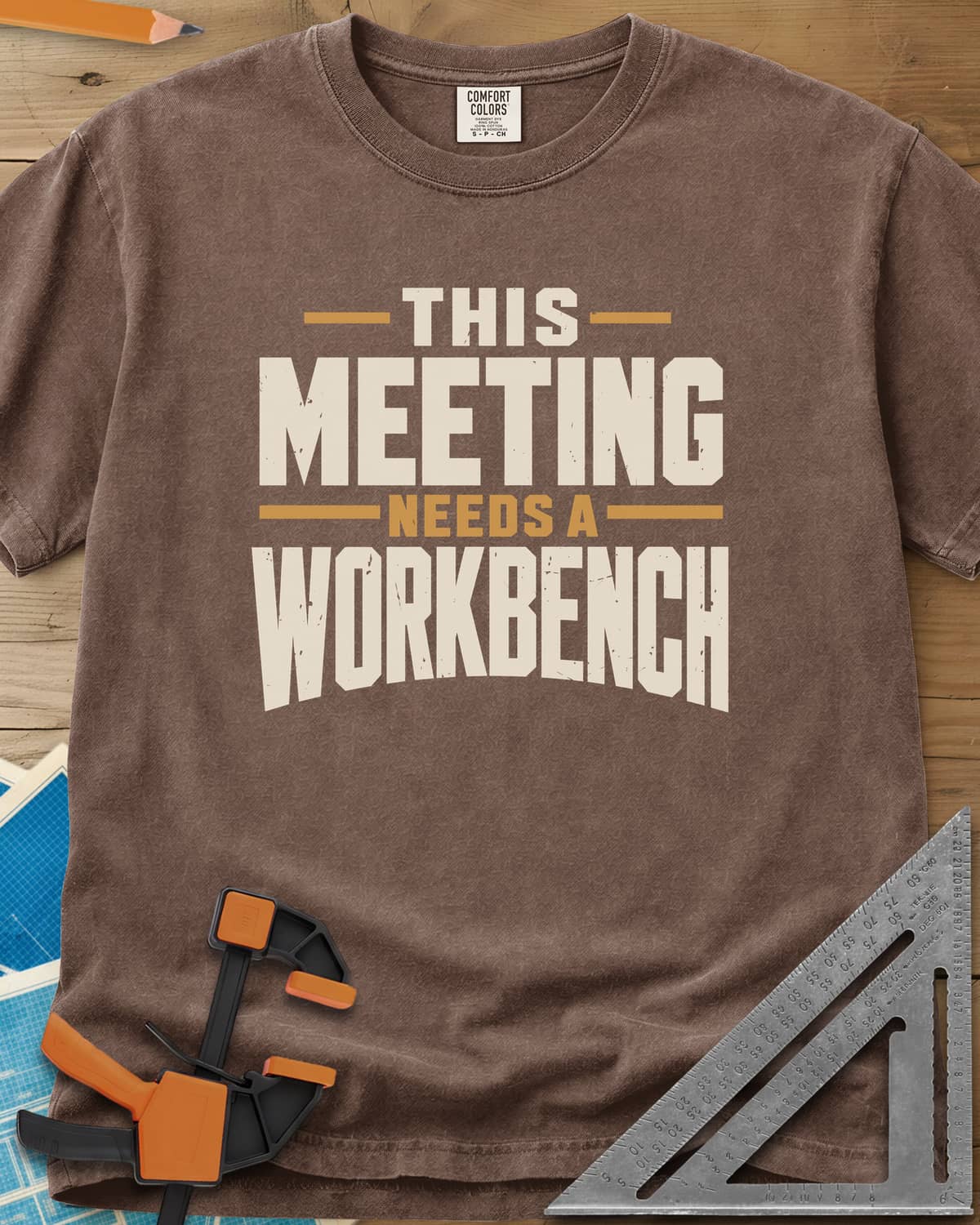 Meeting Workbench heavyweight tee in Espresso, distressed block capitals in cream and gold, no graphic