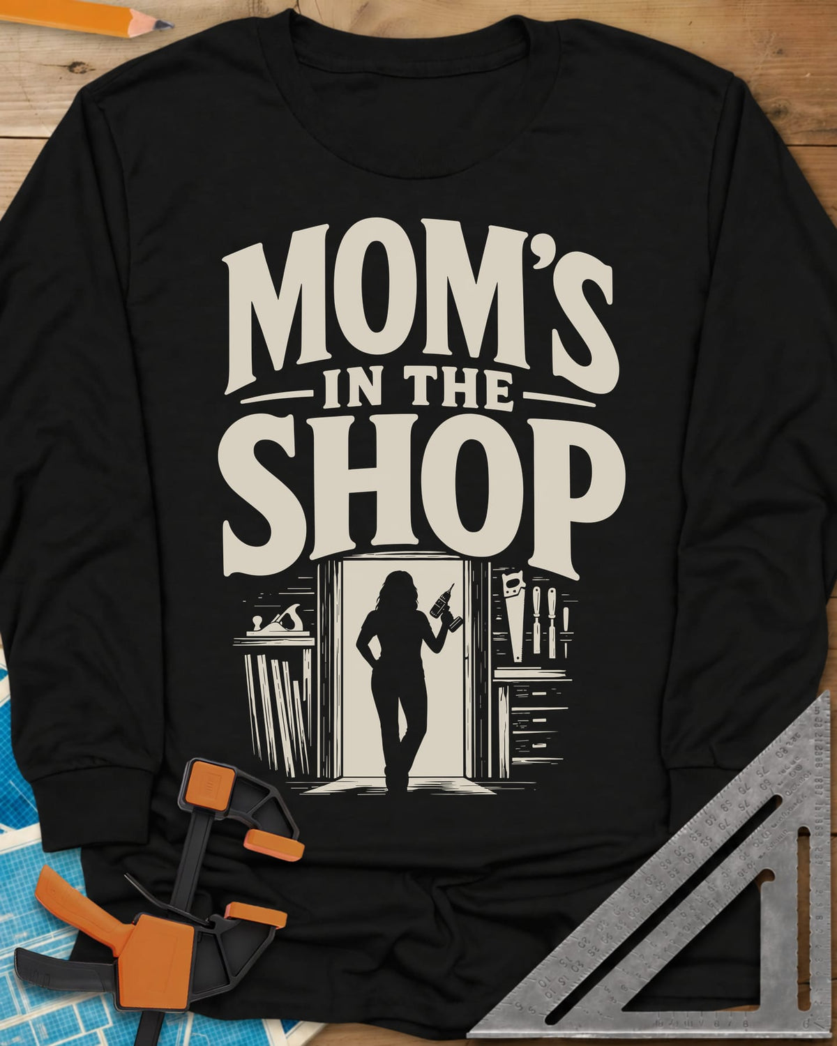 Mom'S Shop long sleeve shirt in Black, silhouette of a woman with a cordless drill in a shop doorway