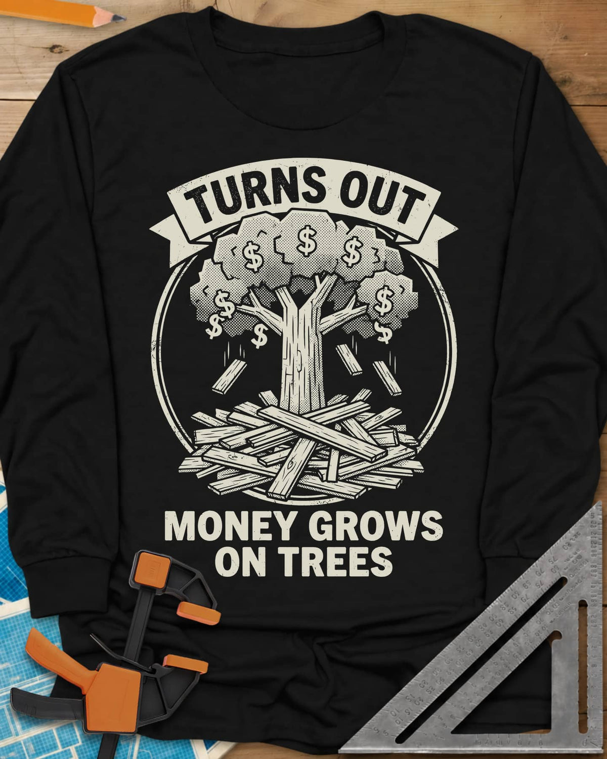 Money Grows On Trees long sleeve shirt in Black, a round emblem of a tree with dollar-sign leaves above a lumber pile